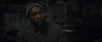 Movie still from “Synchronic” (2019), directed by Justin Benson – A man wearing a hat and a jacket; Close Up shot, Over the shoulder angle