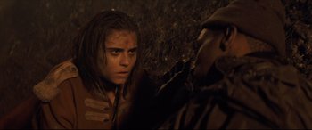 Movie still from “Synchronic” (2019), directed by Justin Benson – A young man is looking at another young man; Close Up shot, Over the shoulder angle