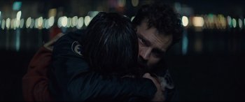 Movie still from “Synchronic” (2019), directed by Justin Benson – A man and a woman hugging in the dark at night; Close Up shot, Over the shoulder angle