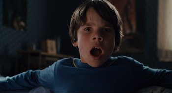 Movie still from “Ted” (2012), directed by Seth MacFarlane – A young boy with his mouth wide open looking surprised; Close Up shot, Low angle