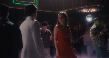 Movie still from “Ted” (2012), directed by Seth MacFarlane – A man and a woman are dancing in a room; Medium shot, Over the shoulder angle