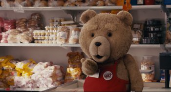 Movie still from “Ted” (2012), directed by Seth MacFarlane – A teddy bear in a red apron in a grocery store; Medium shot, Over the shoulder angle