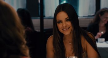 Movie still from “Ted” (2012), directed by Seth MacFarlane – A beautiful young woman sitting at a table; Close Up shot, Over the shoulder angle