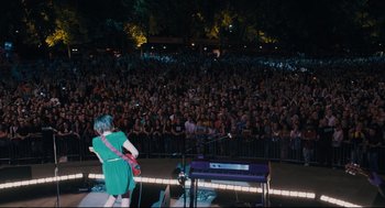 Movie still from “Ted” (2012), directed by Seth MacFarlane – A crowd of people in front of a stage; Extreme Wide shot, High angle