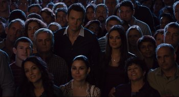 Movie still from “Ted” (2012), directed by Seth MacFarlane – A group of people standing in front of each other; Medium shot, High angle
