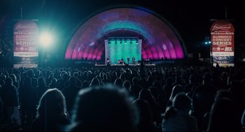 Movie still from “Ted” (2012), directed by Seth MacFarlane – A crowd of people watching a concert at night; Extreme Wide shot, High angle