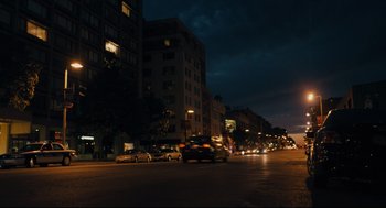 Movie still from “Ted” (2012), directed by Seth MacFarlane – Cars are driving down a street at night; Extreme Wide shot, Low angle