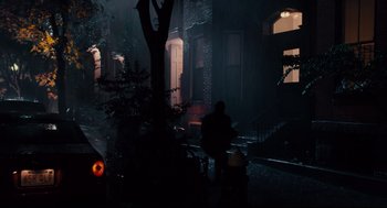 Movie still from “Ted” (2012), directed by Seth MacFarlane – A person sitting on a bench in the dark; Extreme Wide shot, High angle