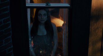 Movie still from “Ted” (2012), directed by Seth MacFarlane – A woman standing in front of an open window; Medium shot, High angle