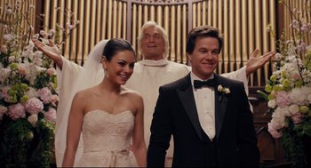 Movie still from “Ted” (2012), directed by Seth MacFarlane – A man and a woman standing next to each other in front of an organ; Close Up shot, Over the shoulder angle