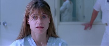 Movie still from “Terminator 2: Judgment Day” (1991), directed by James Cameron – A person with long hair; Close Up shot, Over the shoulder angle