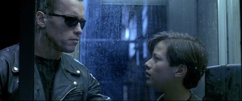 Movie still from “Terminator 2: Judgment Day” (1991), directed by James Cameron – A man and a woman are looking at each other; Close Up shot, Over the shoulder angle