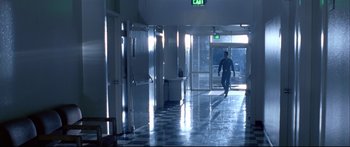 Movie still from “Terminator 2: Judgment Day” (1991), directed by James Cameron – A man walking down a hall way in a building; Extreme Wide shot, Low angle