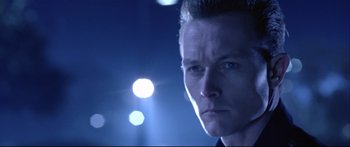 Movie still from “Terminator 2: Judgment Day” (1991), directed by James Cameron – A man's face in the dark; Close Up shot, Low angle