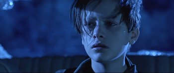 Movie still from “Terminator 2: Judgment Day” (1991), directed by James Cameron – A person with wet hair; Close Up shot, Low angle