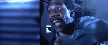 Movie still from “Terminator 2: Judgment Day” (1991), directed by James Cameron – A person wearing a tie; Close Up shot, Low angle