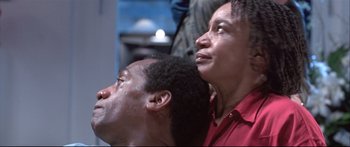 Movie still from “Terminator 2: Judgment Day” (1991), directed by James Cameron – A man and a woman looking up at the sky; Close Up shot, Low angle