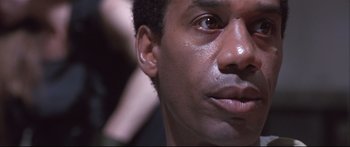 Movie still from “Terminator 2: Judgment Day” (1991), directed by James Cameron – A person's face with ear piercings; Close Up shot, Low angle