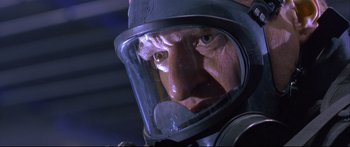 Movie still from “Terminator 2: Judgment Day” (1991), directed by James Cameron – An older man wearing a helmet and a gas mask; Close Up shot, Low angle