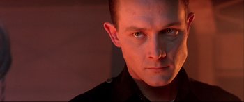 Movie still from “Terminator 2: Judgment Day” (1991), directed by James Cameron – A person wearing a black shirt; Close Up shot, Low angle
