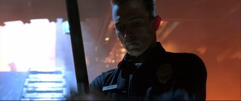 Movie still from “Terminator 2: Judgment Day” (1991), directed by James Cameron – A man in a uniform holding a sword in his hand; Close Up shot, Low angle
