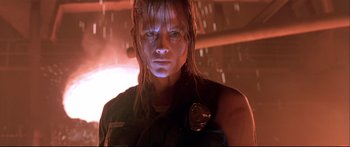 Movie still from “Terminator 2: Judgment Day” (1991), directed by James Cameron – A person wearing a black shirt; Close Up shot, Low angle