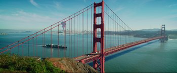Movie still from “Terminator Genisys” (2015), directed by Alan Taylor – A boat is sailing across the golden gate bridge in san francisco; Extreme Wide shot, Low angle