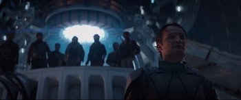 Movie still from “Terminator Genisys” (2015), directed by Alan Taylor – A group of people standing in a room; Medium shot, Low angle