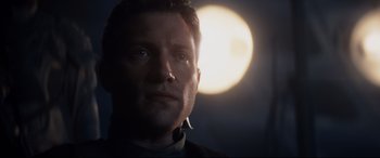 Movie still from “Terminator Genisys” (2015), directed by Alan Taylor – A person looking at the camera; Close Up shot, Low angle