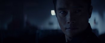 Movie still from “Terminator Genisys” (2015), directed by Alan Taylor – A man's face in a dark room; Close Up shot, Over the shoulder angle