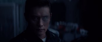 Movie still from “Terminator Genisys” (2015), directed by Alan Taylor – A person wearing a black jacket; Close Up shot, Over the shoulder angle