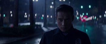 Movie still from “Terminator Genisys” (2015), directed by Alan Taylor – A man in a police uniform standing in the dark; Close Up shot, Low angle