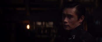 Movie still from “Terminator Genisys” (2015), directed by Alan Taylor – A person in a dark room; Close Up shot, Over the shoulder angle