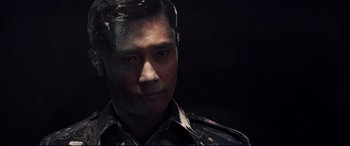 Movie still from “Terminator Genisys” (2015), directed by Alan Taylor – A person wearing a military uniform; Close Up shot, High angle
