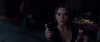 Movie still from “Terminator Genisys” (2015), directed by Alan Taylor – A woman is holding a gun in a dark room; Close Up shot, Over the shoulder angle