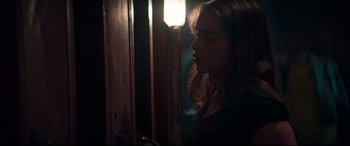 Movie still from “Terminator Genisys” (2015), directed by Alan Taylor – A woman standing next to a window in a dark room; Close Up shot, Over the shoulder angle