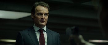 Movie still from “Terminator Genisys” (2015), directed by Alan Taylor – A person wearing a suit and tie; Close Up shot, Low angle