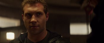 Movie still from “Terminator Genisys” (2015), directed by Alan Taylor – A person wearing a black shirt; Close Up shot, Low angle