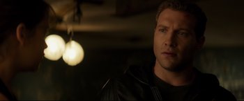 Movie still from “Terminator Genisys” (2015), directed by Alan Taylor – A person wearing a black leather jacket; Close Up shot, Over the shoulder angle