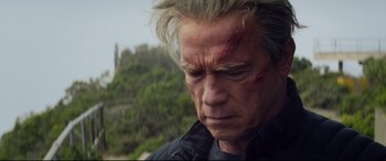Movie still from “Terminator Genisys” (2015), directed by Alan Taylor – A person with a head wound; Close Up shot, Low angle