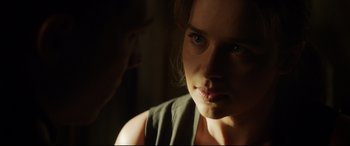 Movie still from “Terminator Genisys” (2015), directed by Alan Taylor – A person looking at the camera; Close Up shot, Over the shoulder angle