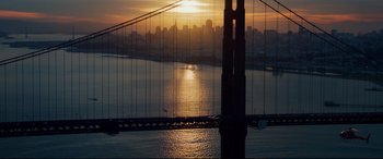 Movie still from “Terminator Genisys” (2015), directed by Alan Taylor – The sun is setting over a city and a bridge; Extreme Wide shot, High angle