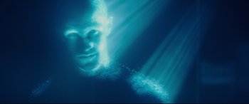 Movie still from “Terminator Genisys” (2015), directed by Alan Taylor – A man is underwater in the ocean with light coming out of his head; Close Up shot, Low angle