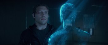 Movie still from “Terminator Genisys” (2015), directed by Alan Taylor – A man standing in front of an image of a person; Close Up shot, Over the shoulder angle