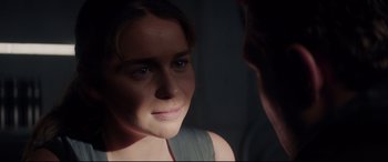 Movie still from “Terminator Genisys” (2015), directed by Alan Taylor – A woman looking at her reflection in a mirror; Close Up shot, Over the shoulder angle