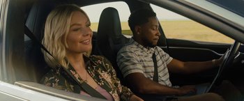 Movie still from “Texas Chainsaw Massacre” (2022), directed by David Blue Garcia – A man and a woman sitting in the driver's seat of a car; Close Up shot, Over the shoulder angle