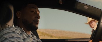 Movie still from “Texas Chainsaw Massacre” (2022), directed by David Blue Garcia – A person in a car looking out the window; Close Up shot, Over the shoulder angle