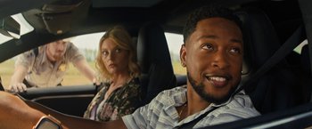 Movie still from “Texas Chainsaw Massacre” (2022), directed by David Blue Garcia – A man and a woman sitting in the back of a car; Close Up shot, Over the shoulder angle