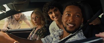 Movie still from “Texas Chainsaw Massacre” (2022), directed by David Blue Garcia – A group of people sitting in the back of a car; Close Up shot, Over the shoulder angle