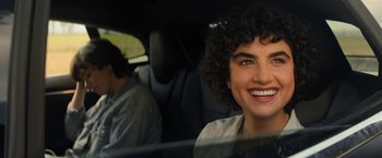 Movie still from “Texas Chainsaw Massacre” (2022), directed by David Blue Garcia – A man and a woman sitting in a car smiling; Close Up shot, Over the shoulder angle